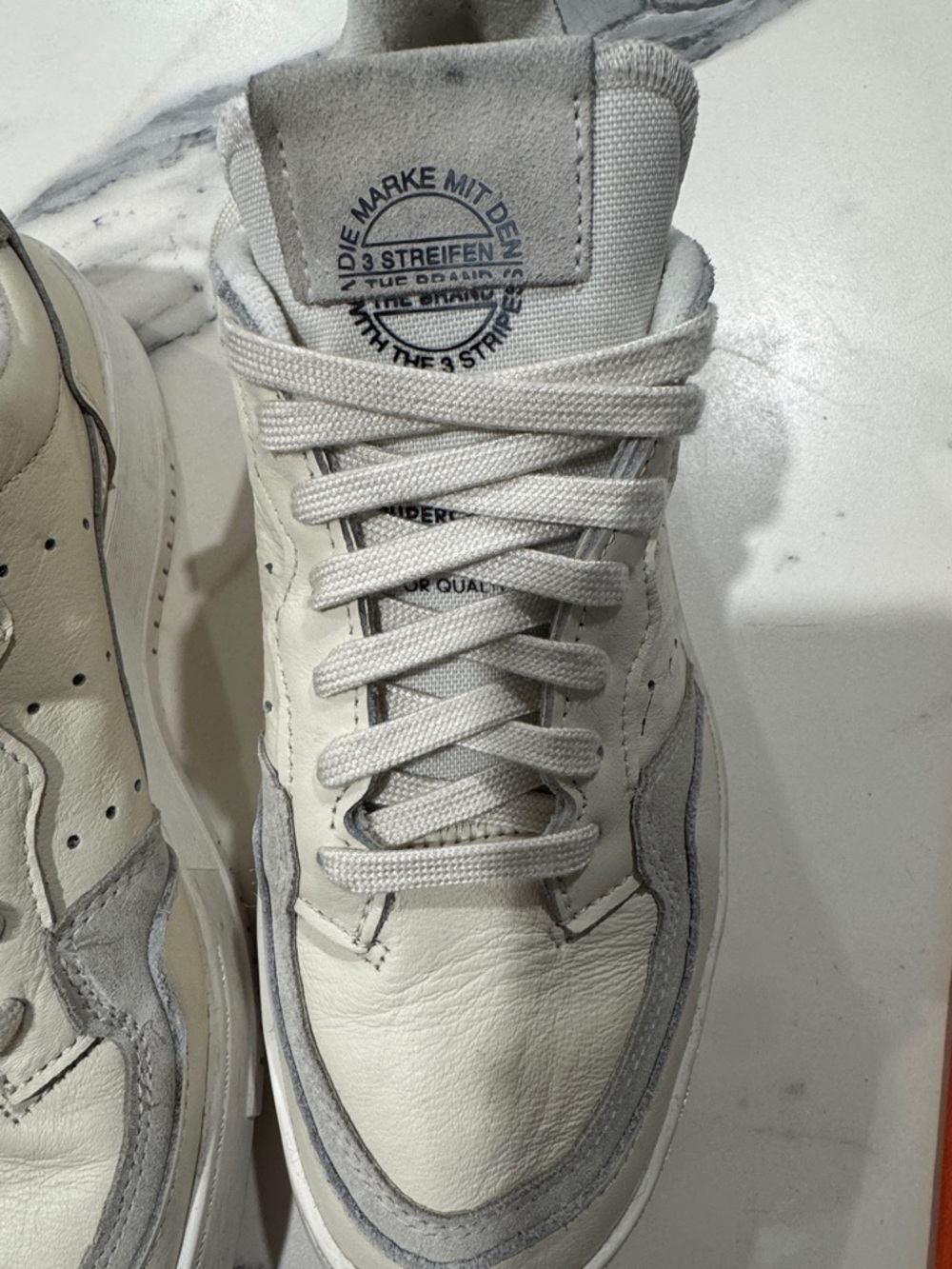 adidas Men’s White and Light Gray Leather Sneakers